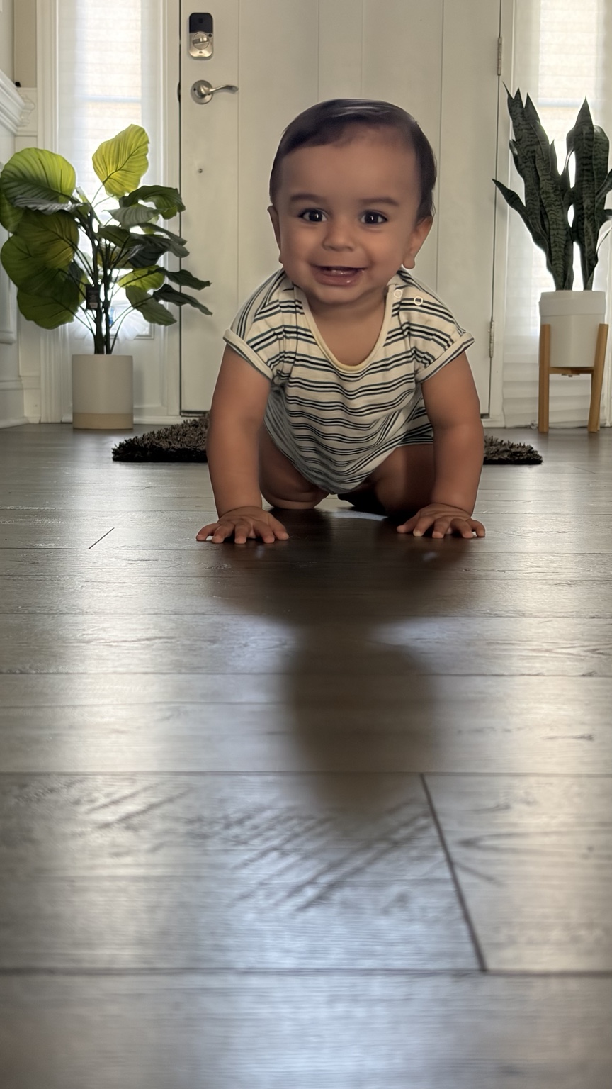 Veer smiling and crawling at home
